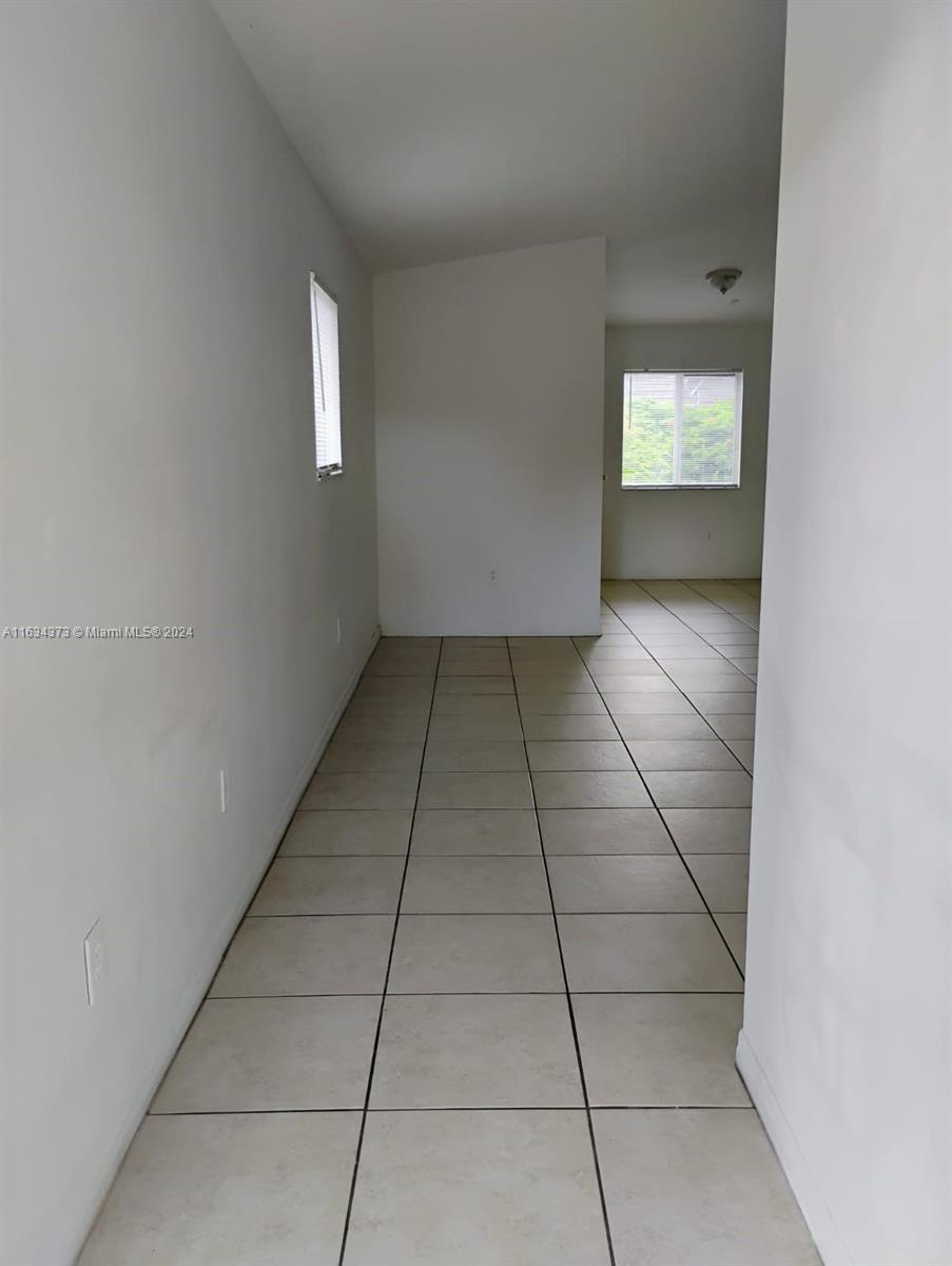 a view of hallway with windows