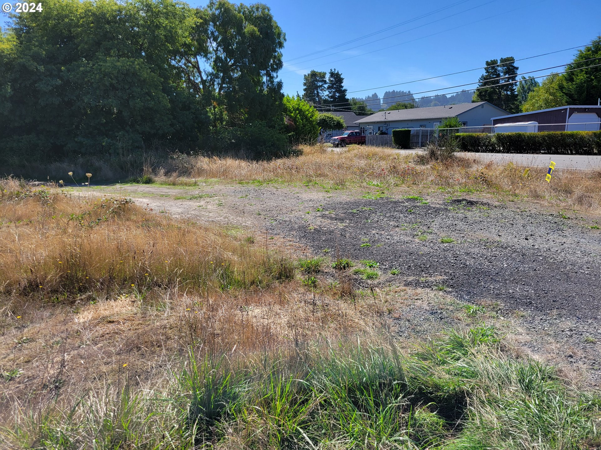 a view of backyard of house and outdoor space