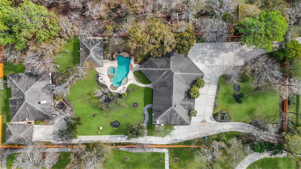 an aerial view of a house with outdoor space