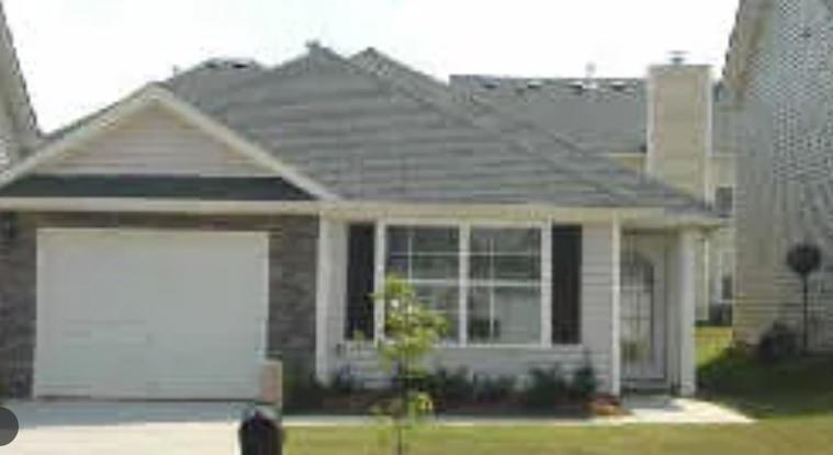 front view of a house with a yard