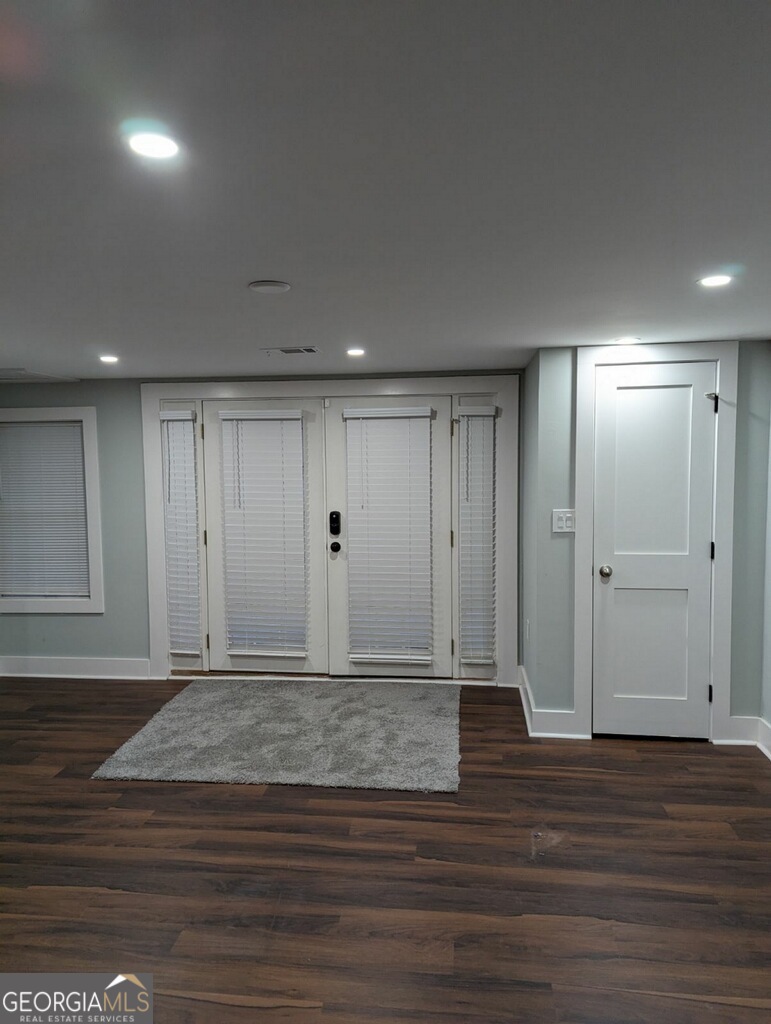 a view of hallway with wooden floor