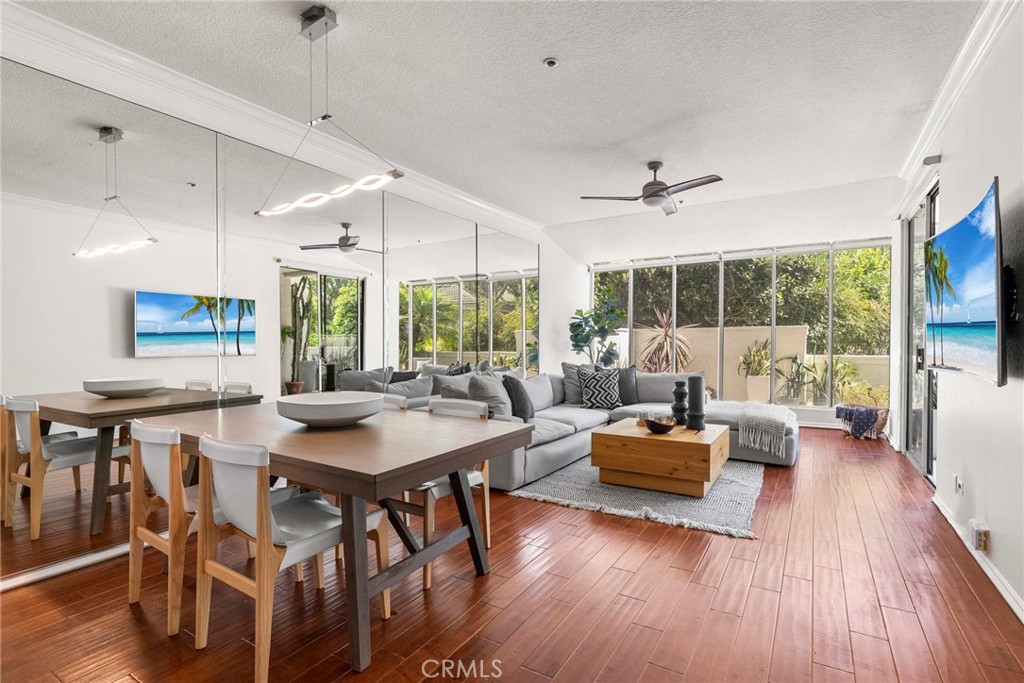 a view of a dining room with furniture window and wooden floor