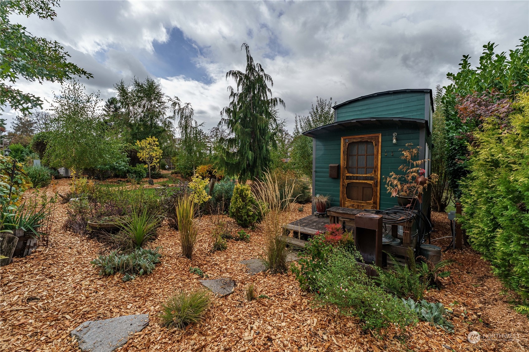 a backyard of a house with outdoor seating