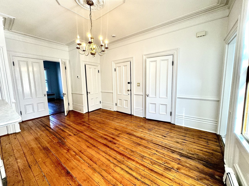 a view of a livingroom with wooden floor