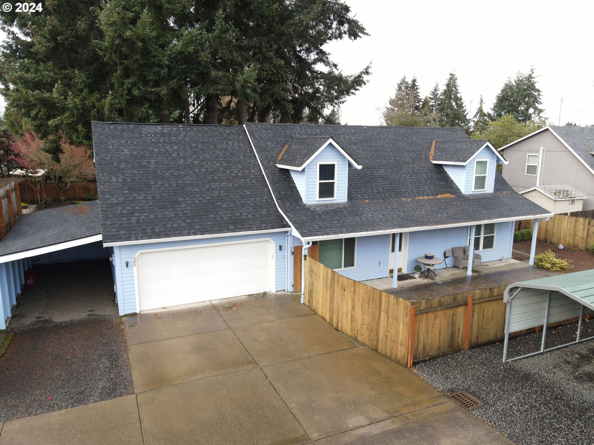 an aerial view of a house with swimming pool