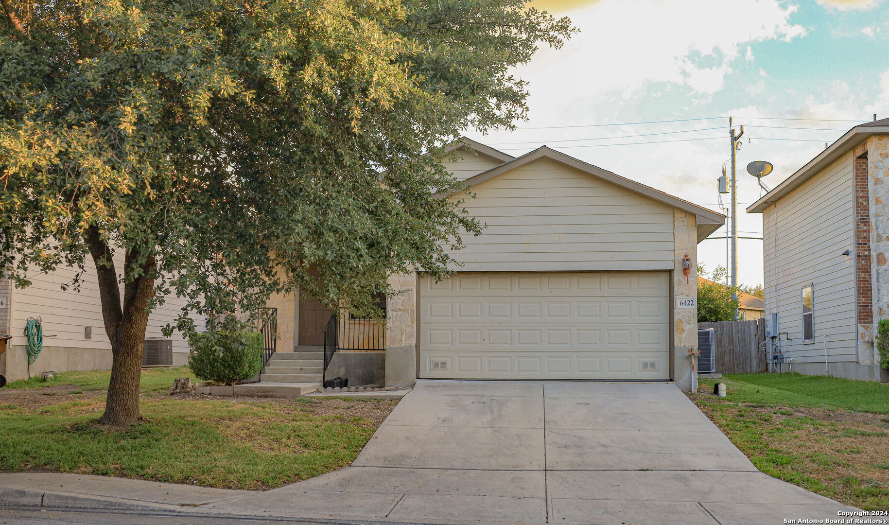 a view of backyard of house with garage