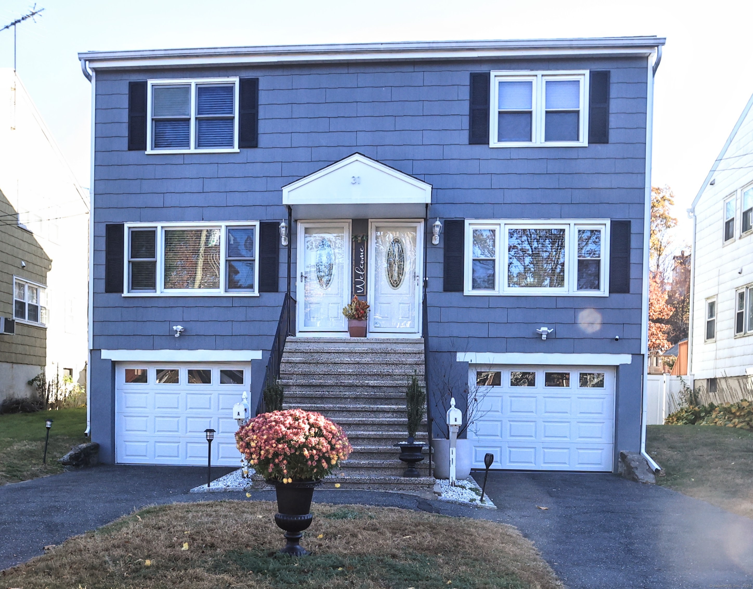 a front view of a house with garden