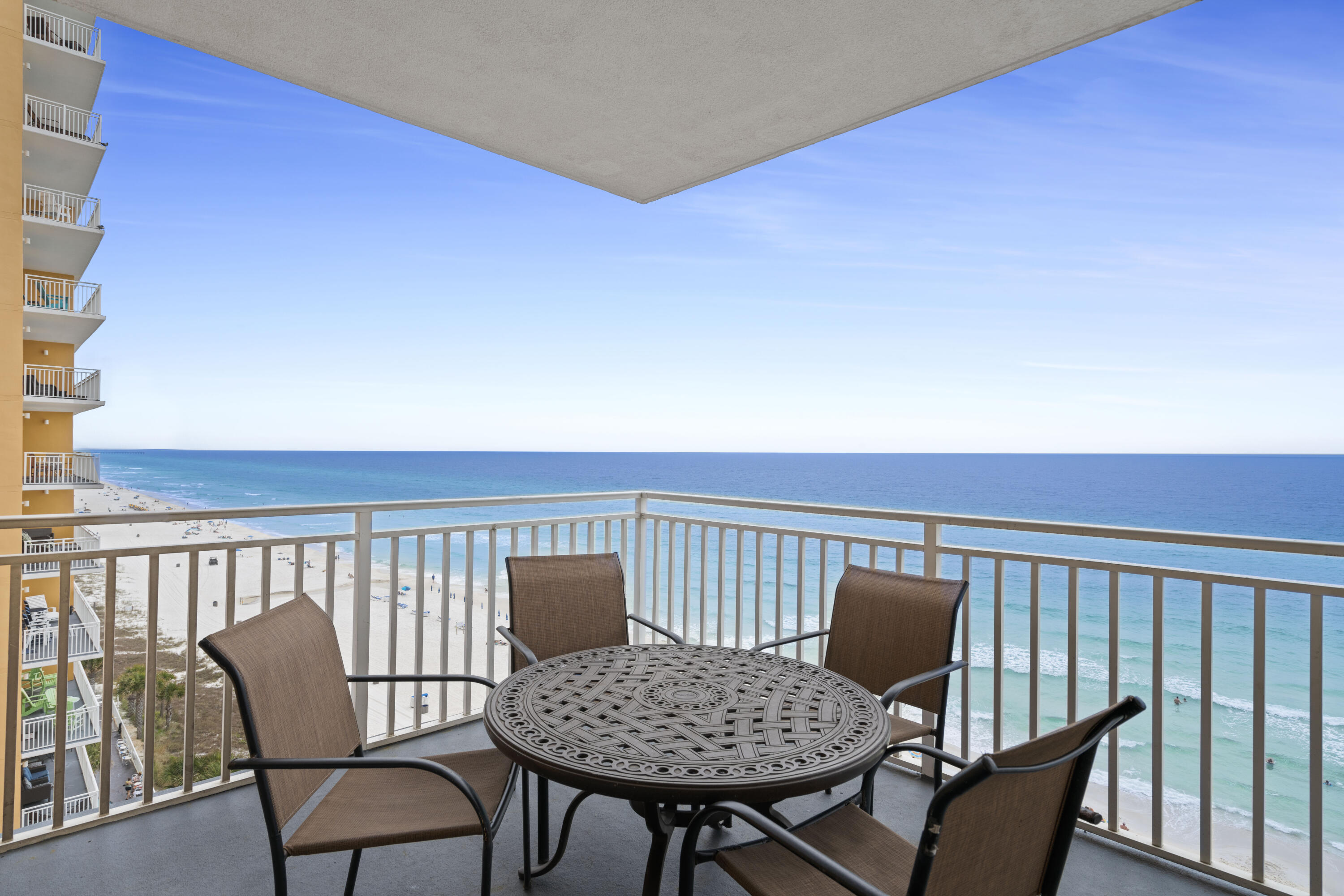 a view of a chair and table on the roof deck