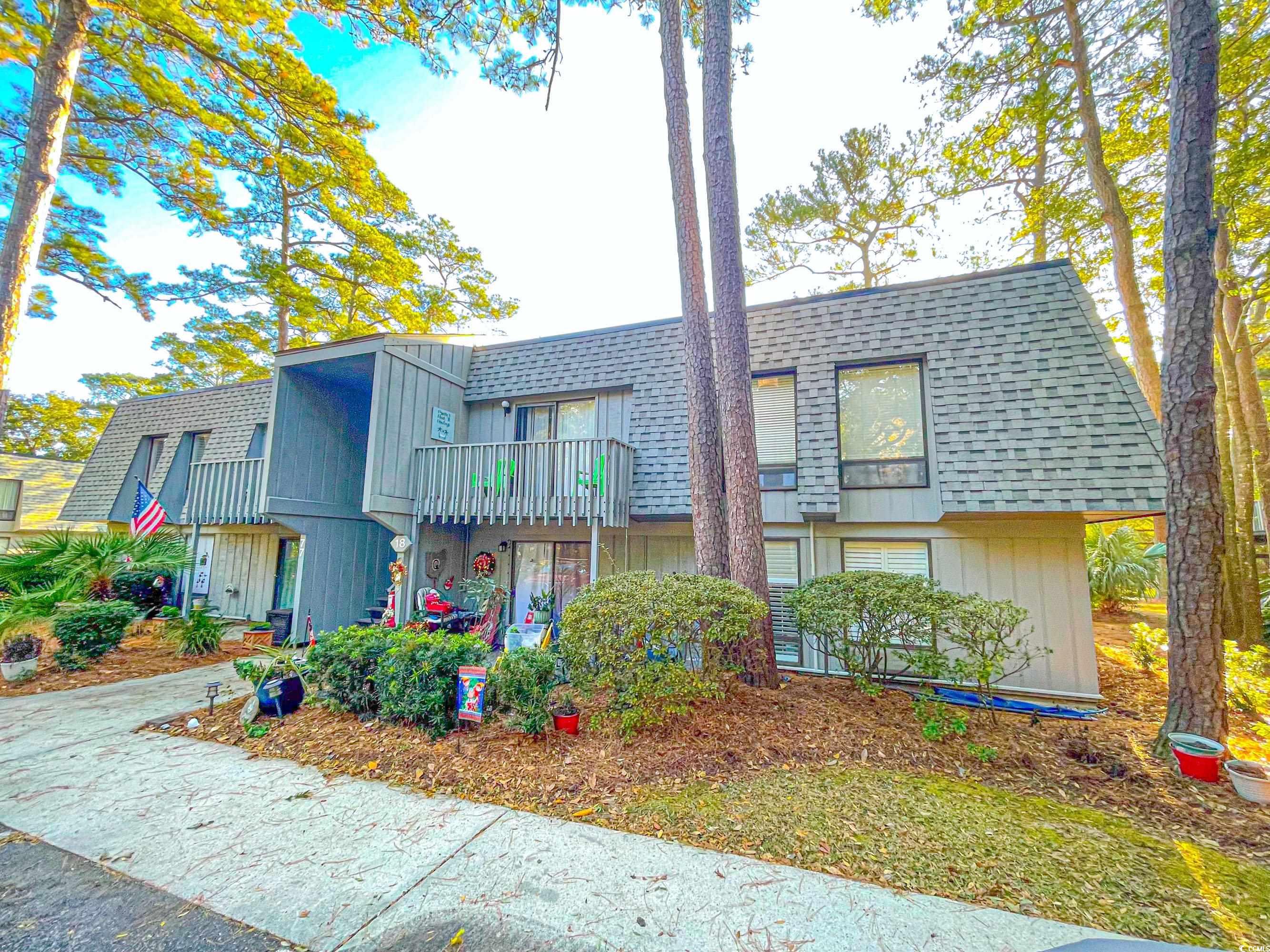 View of front of home with a balcony