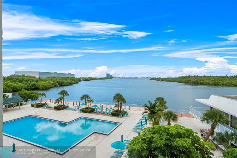 a view of a swimming pool with lounge chair