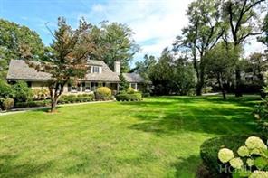 Front View with expansive lawn landscaped to bloom all year