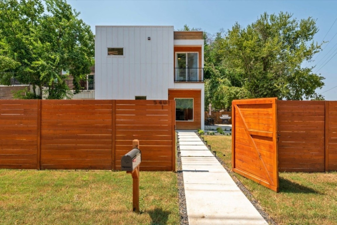 a backyard of a house with brick wall