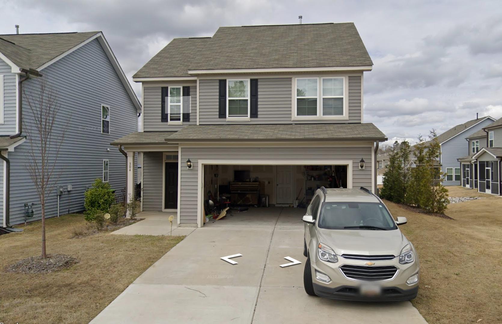 a car parked in front of a house