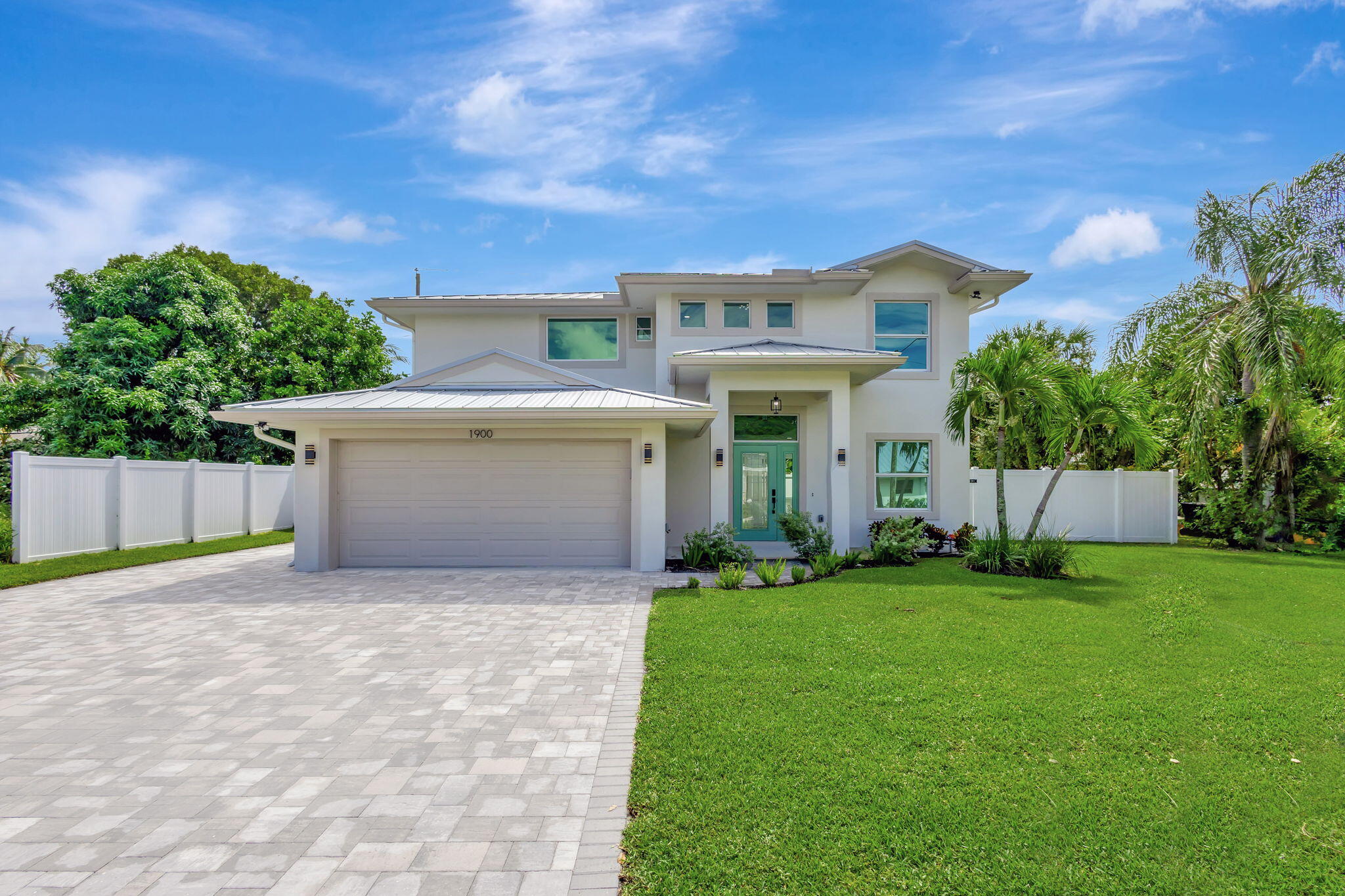 a view of house with backyard and garden