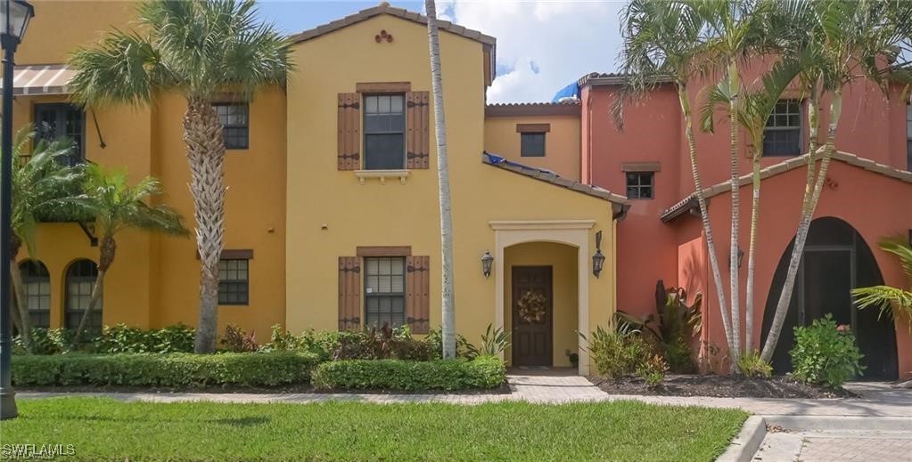 a front view of a house with yard