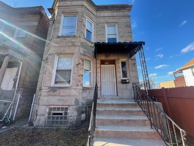 a front view of a house with stairs