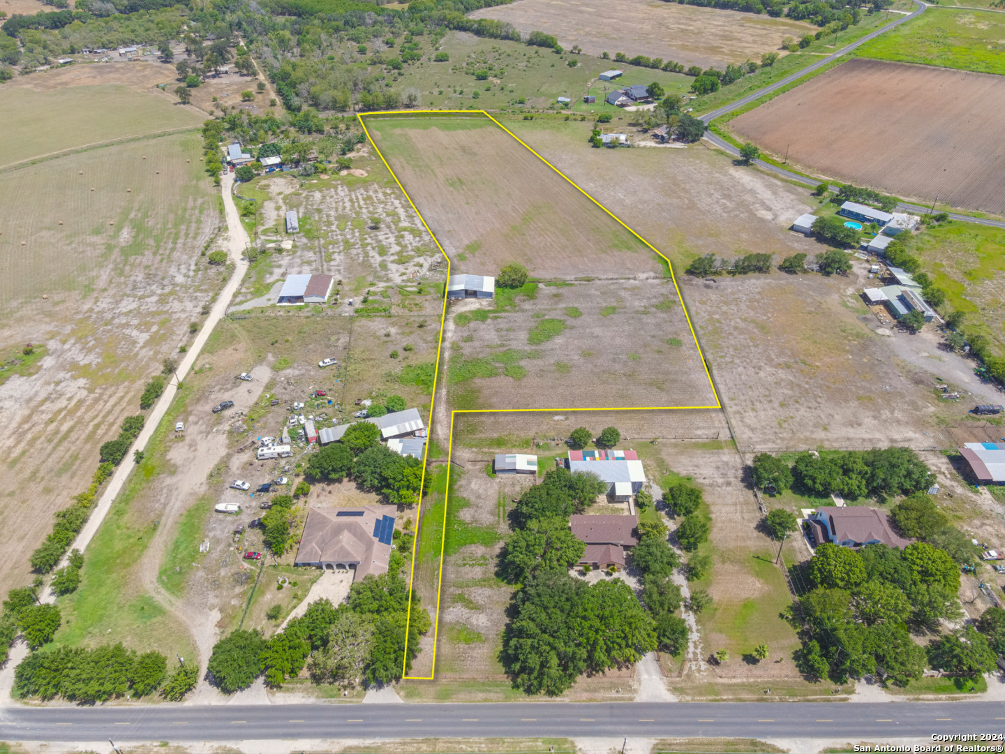 an aerial view of residential houses with outdoor space