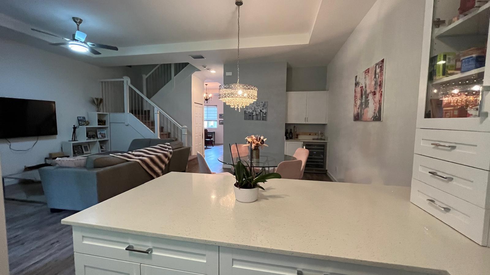 a view of kitchen with furniture and chandelier