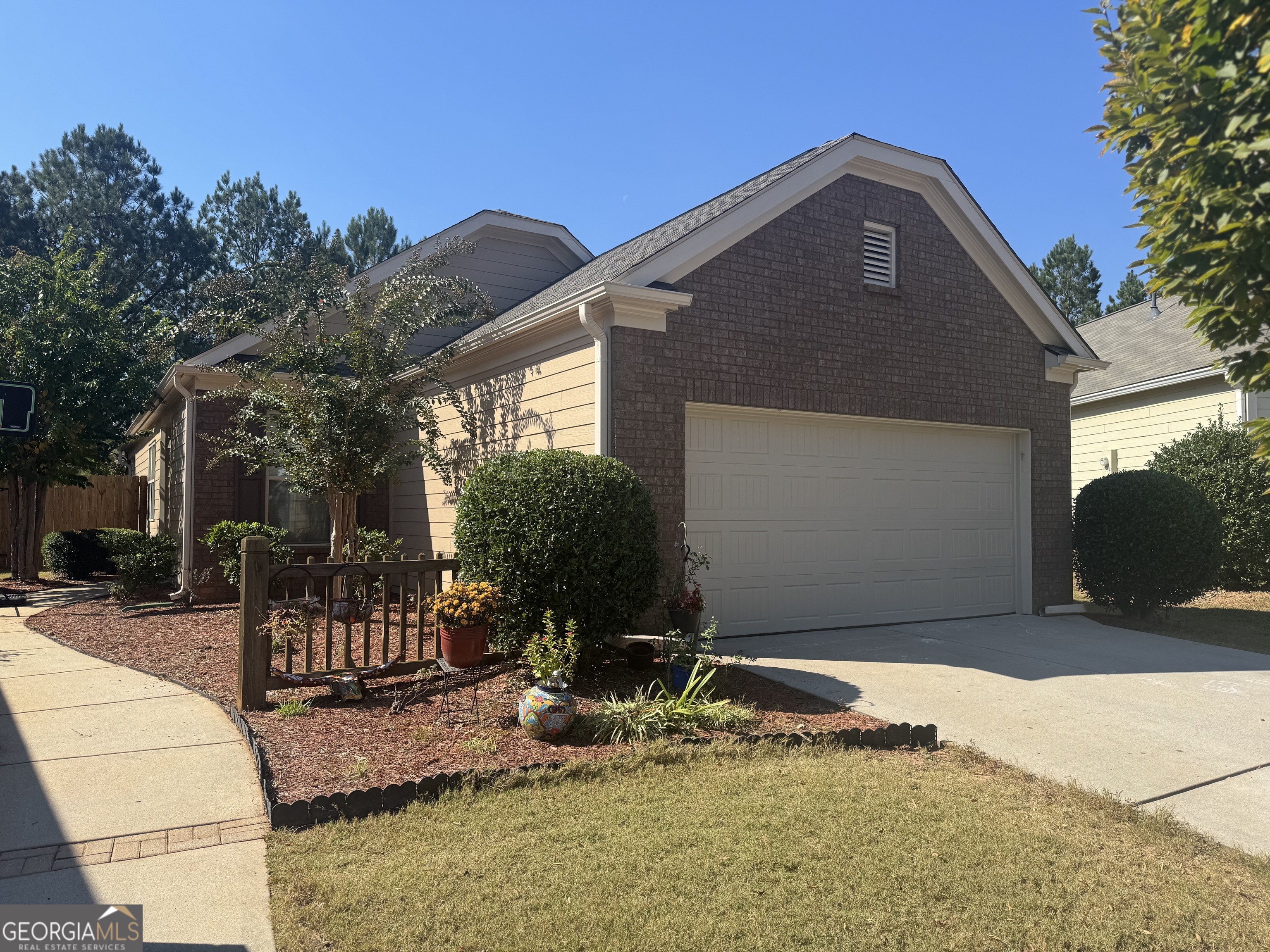 a front view of a house with garden