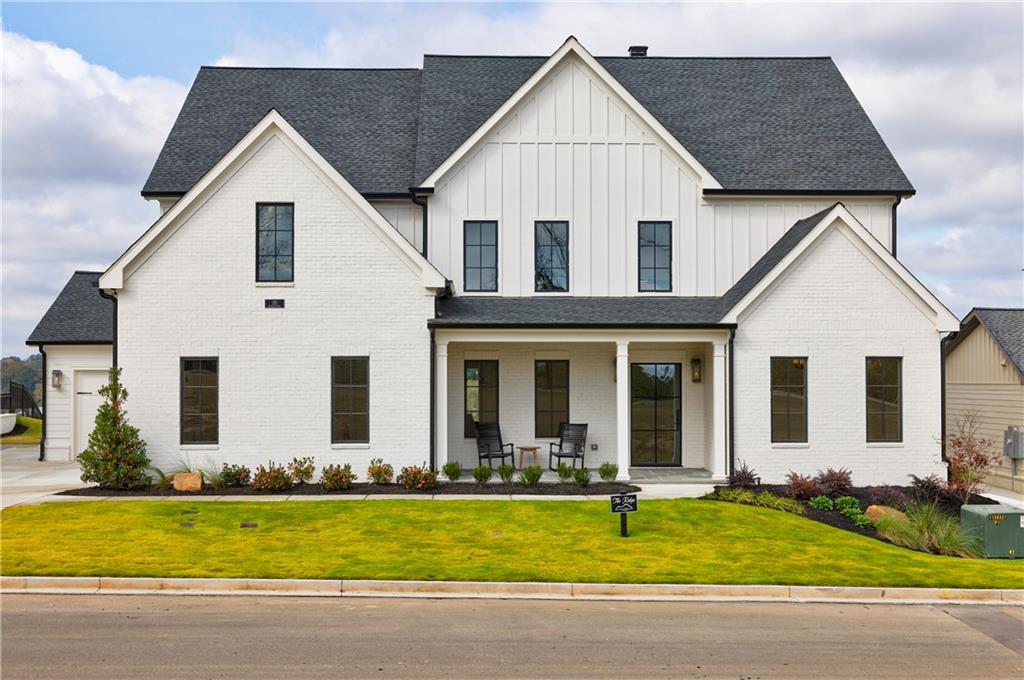 a view of a white house with a yard