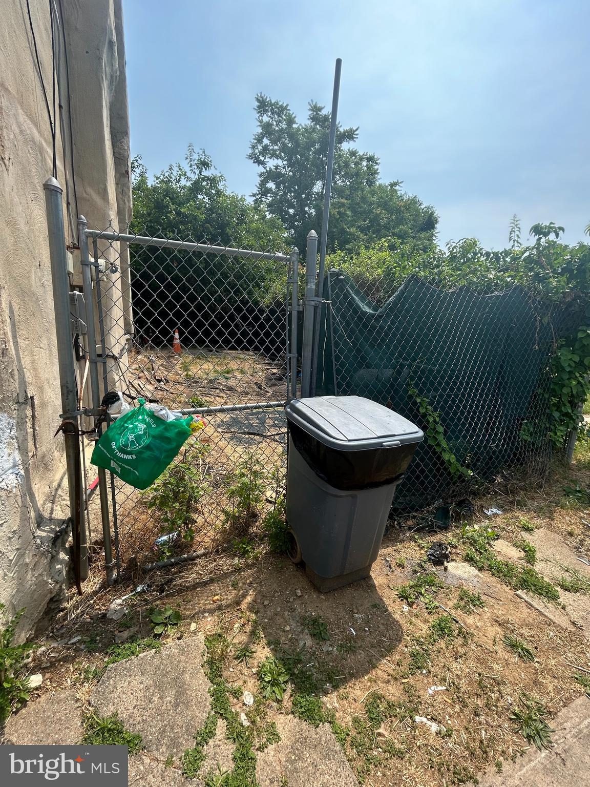 a view of a backyard with sitting area