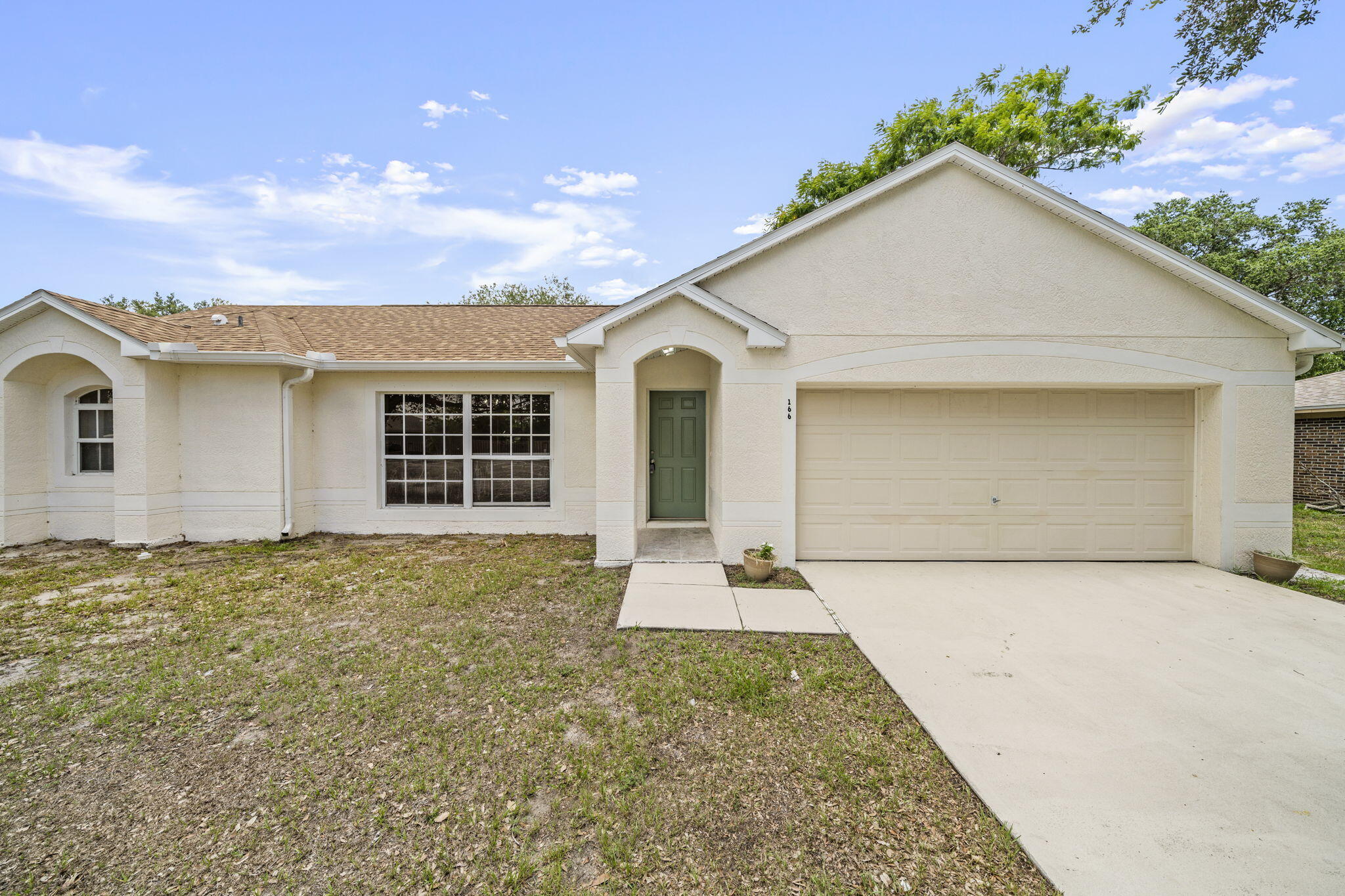 front view of a house with a yard