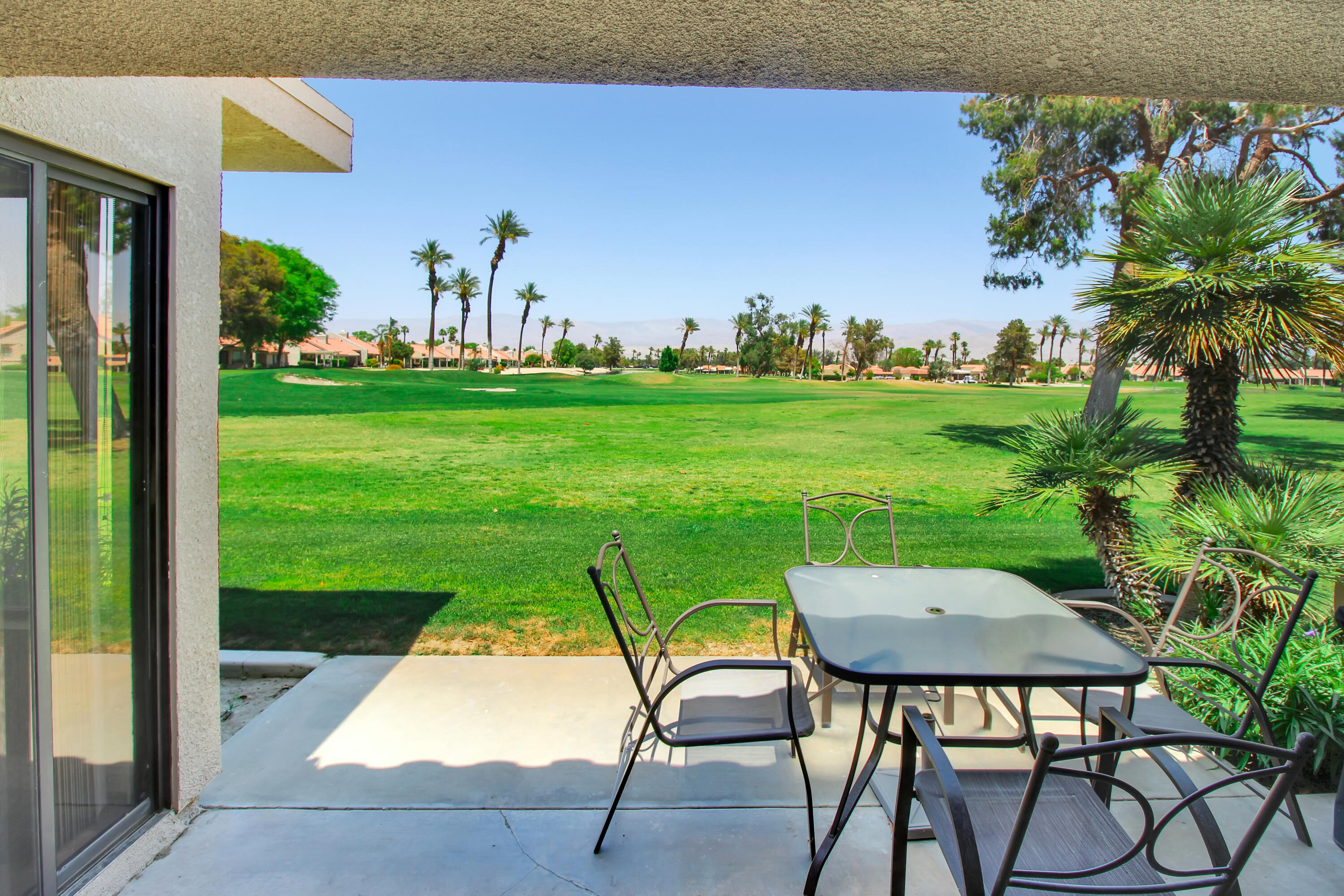 a view of yard with patio