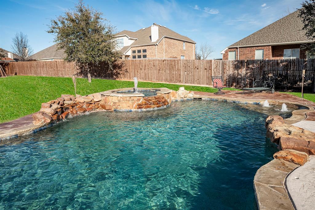 a view of a backyard with a garden and plants