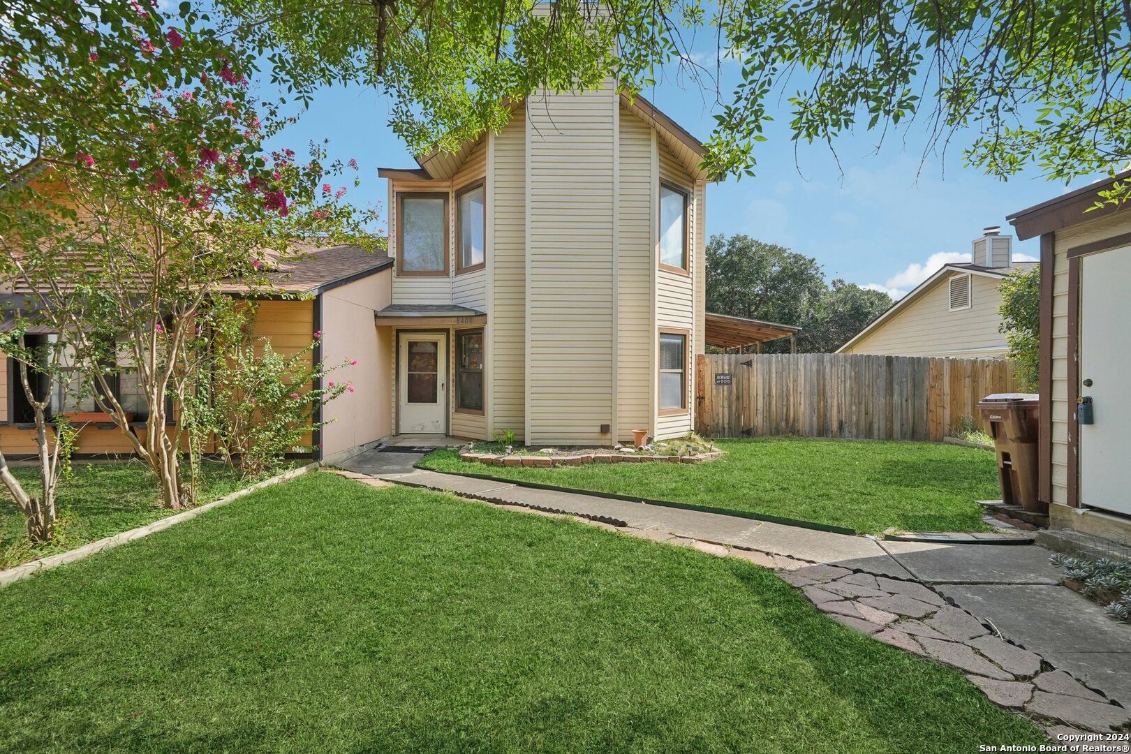 front view of a house with a yard