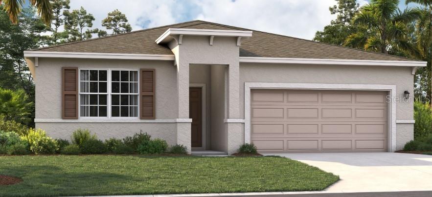 a front view of a house with a yard and garage