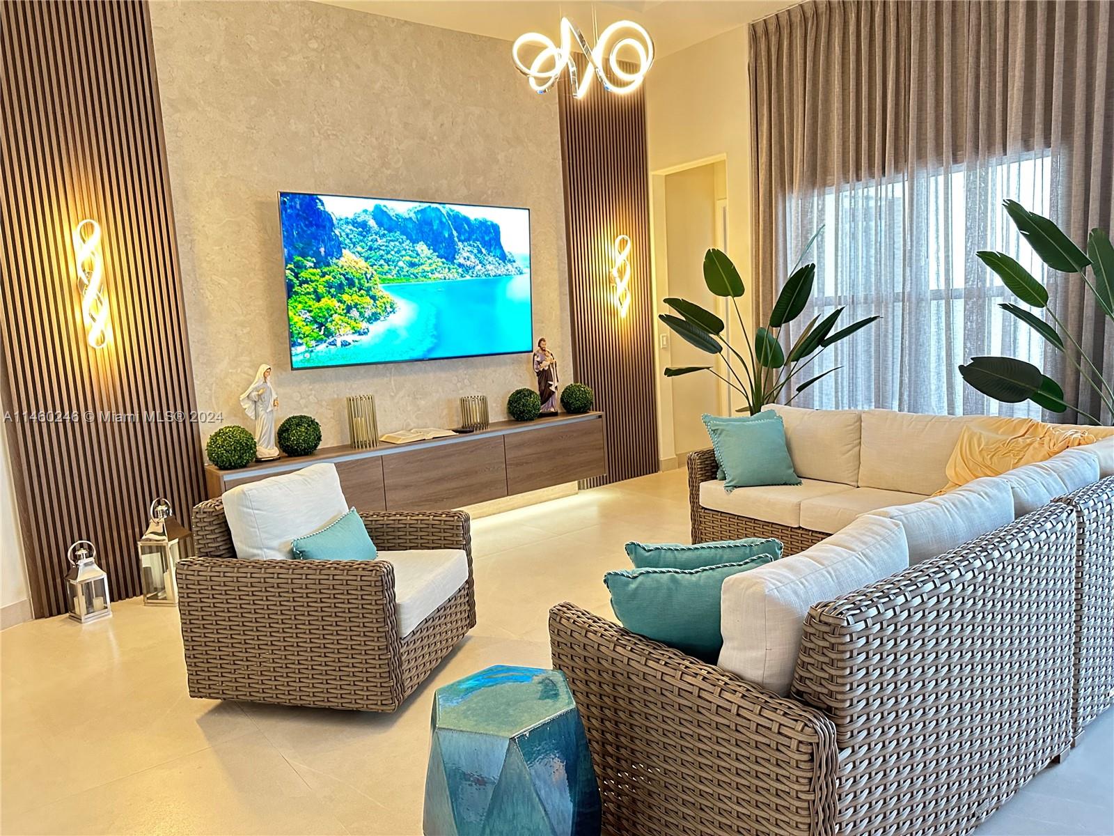 a living room with furniture and a flat screen tv