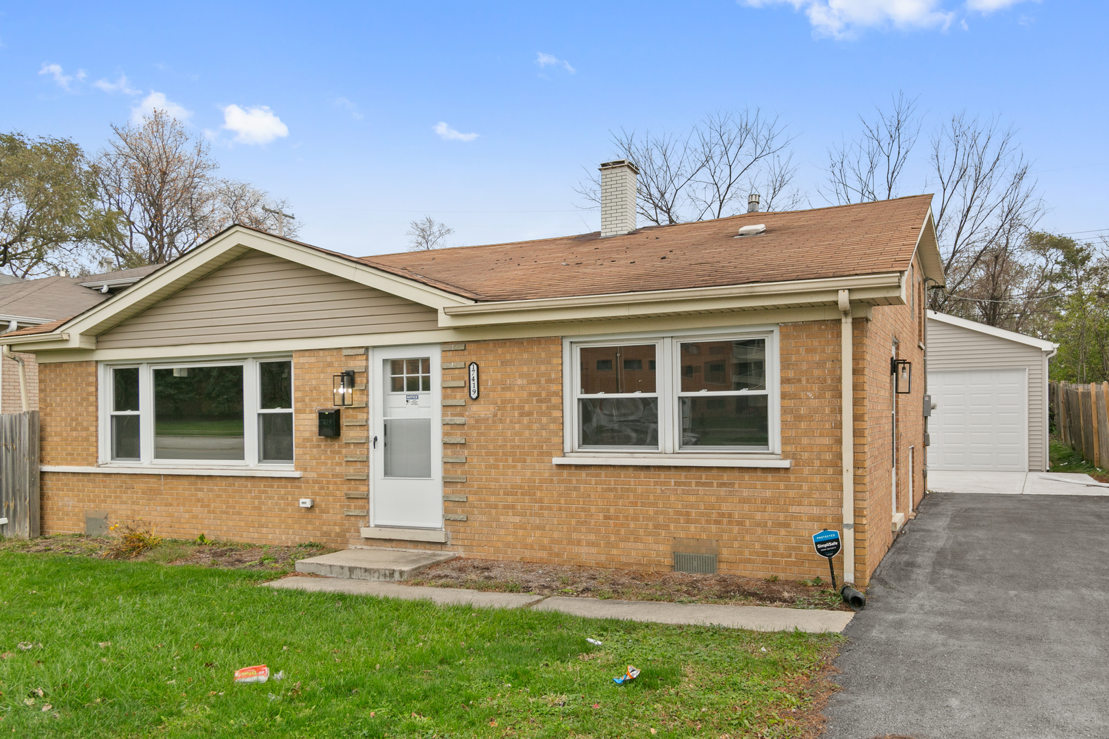 a view of a house with a yard