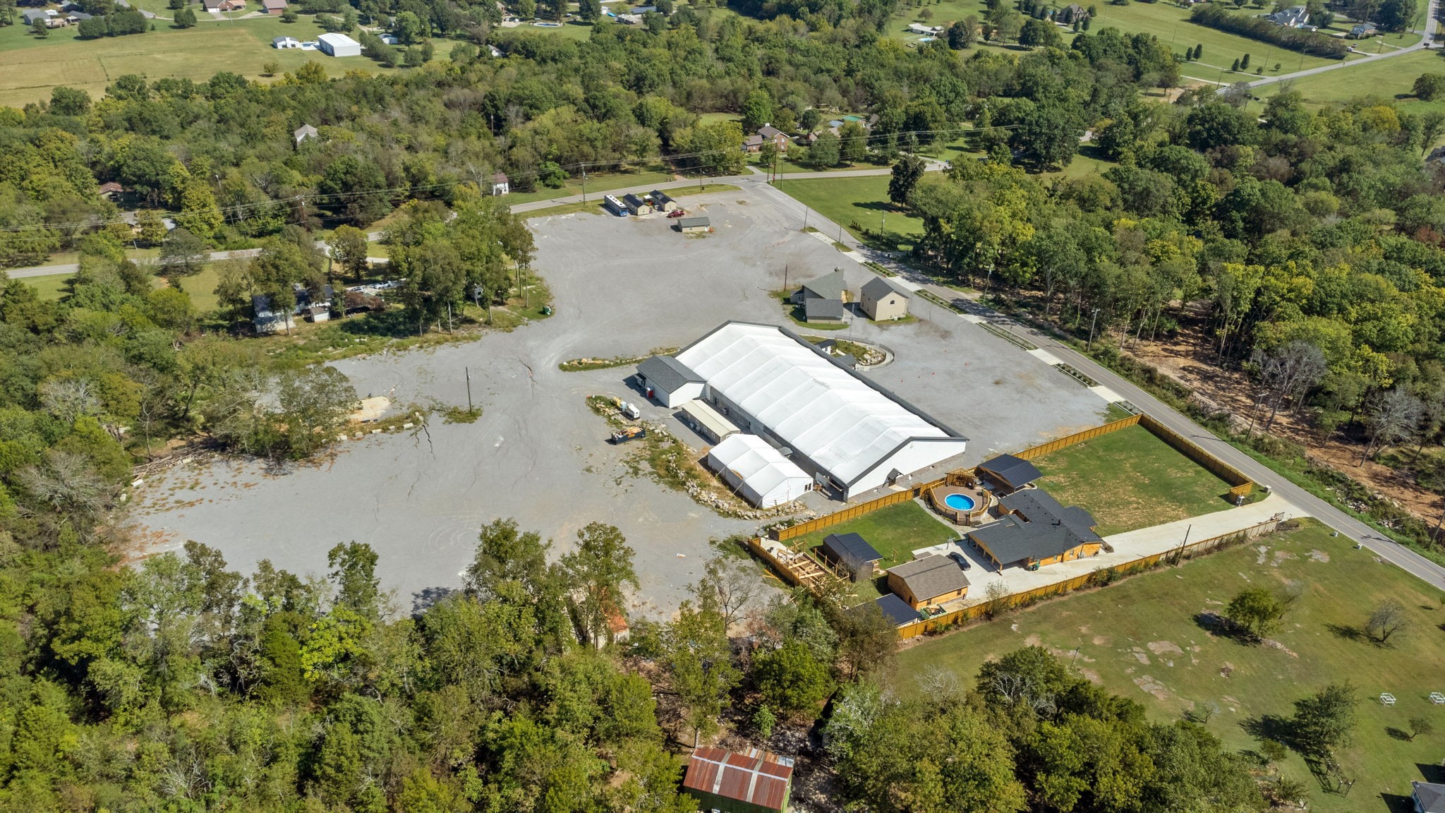 an aerial view of a house with a lake view