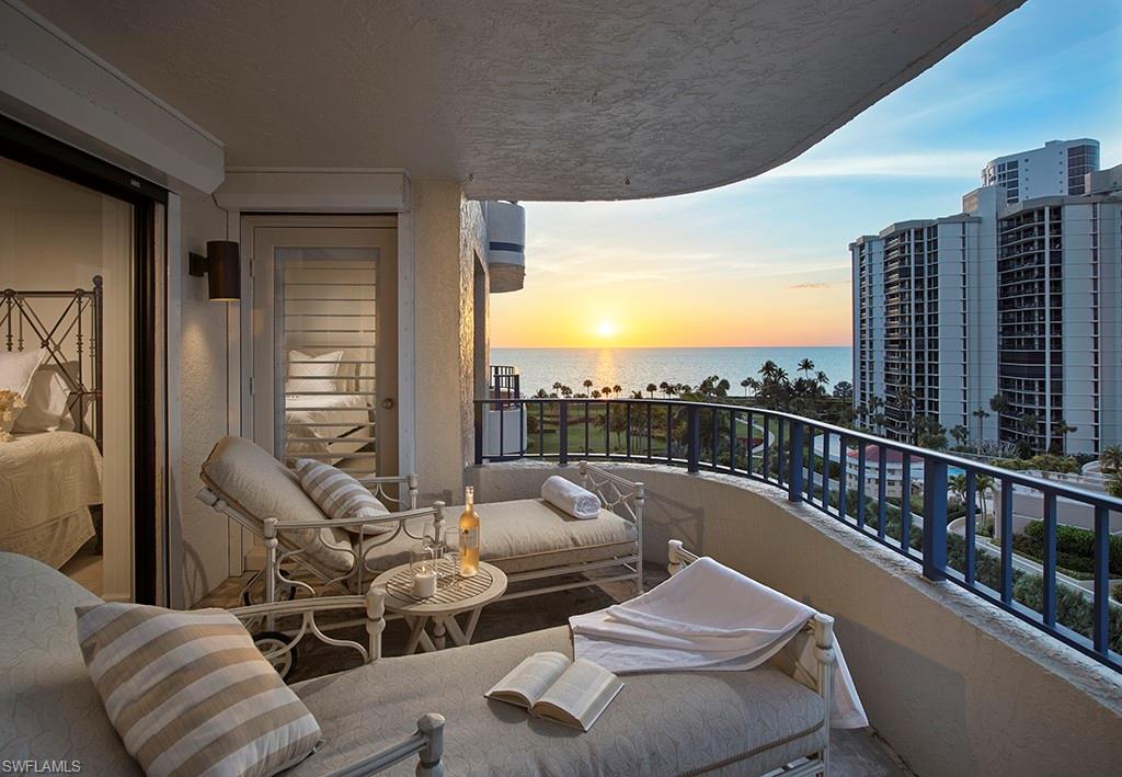 a balcony with furniture and city view