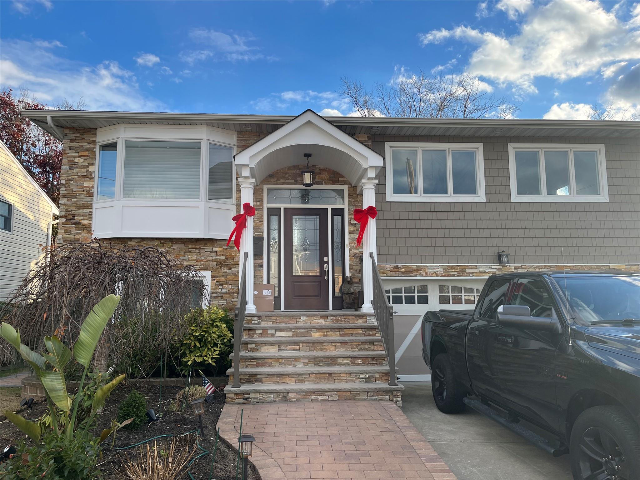 View of front of property featuring a garage