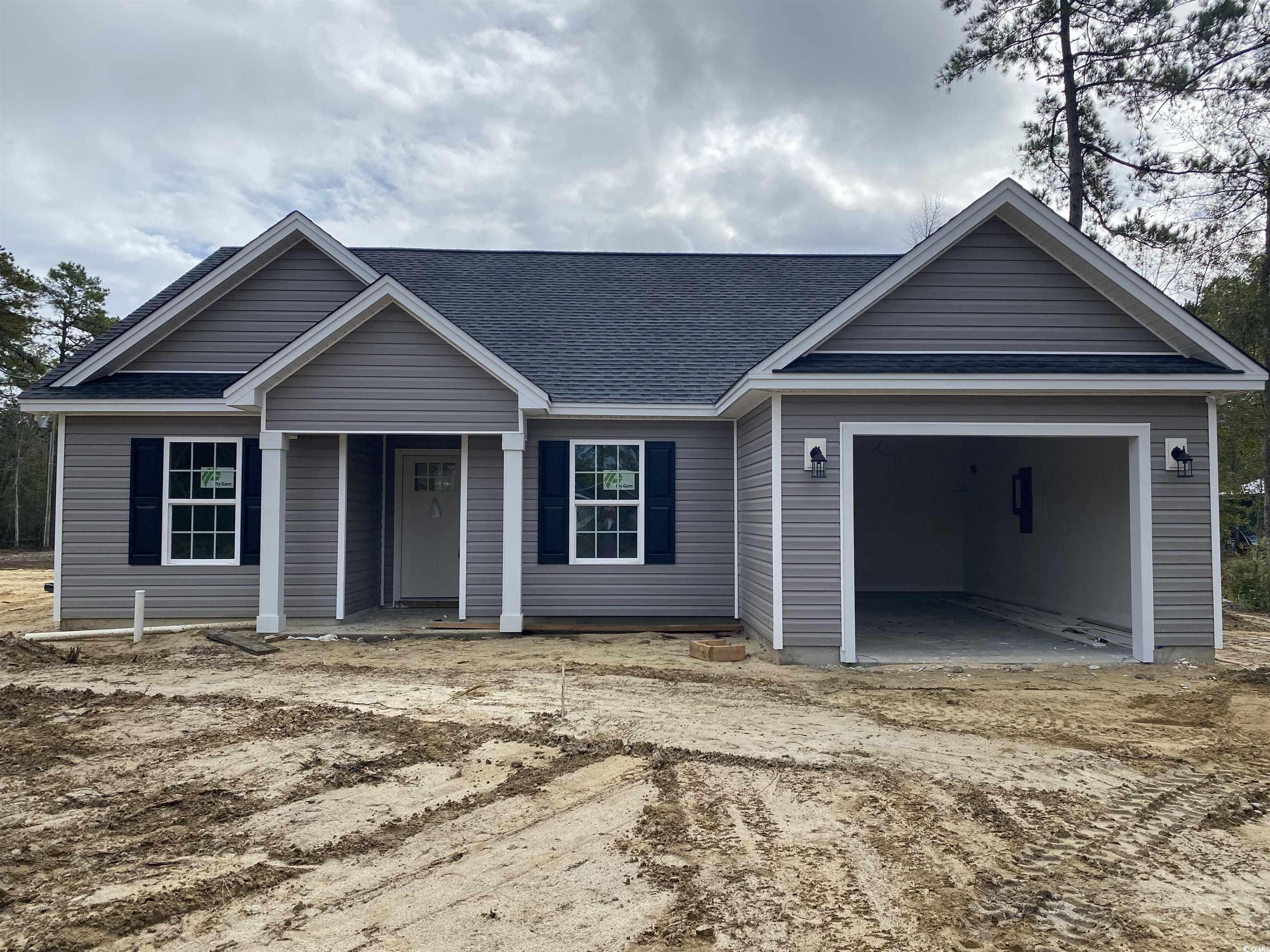 View of front facade featuring a garage