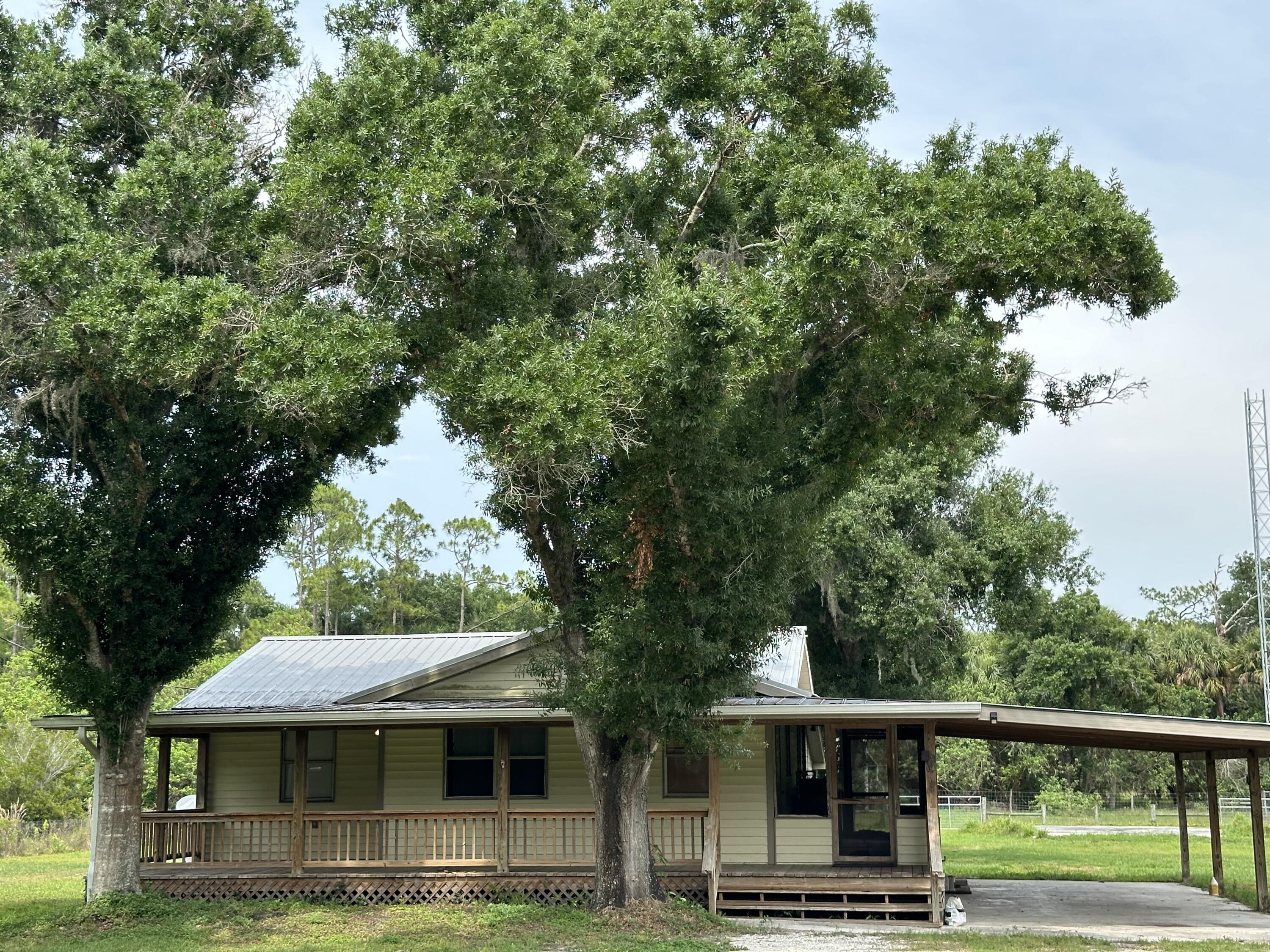 a front view of a house with yard