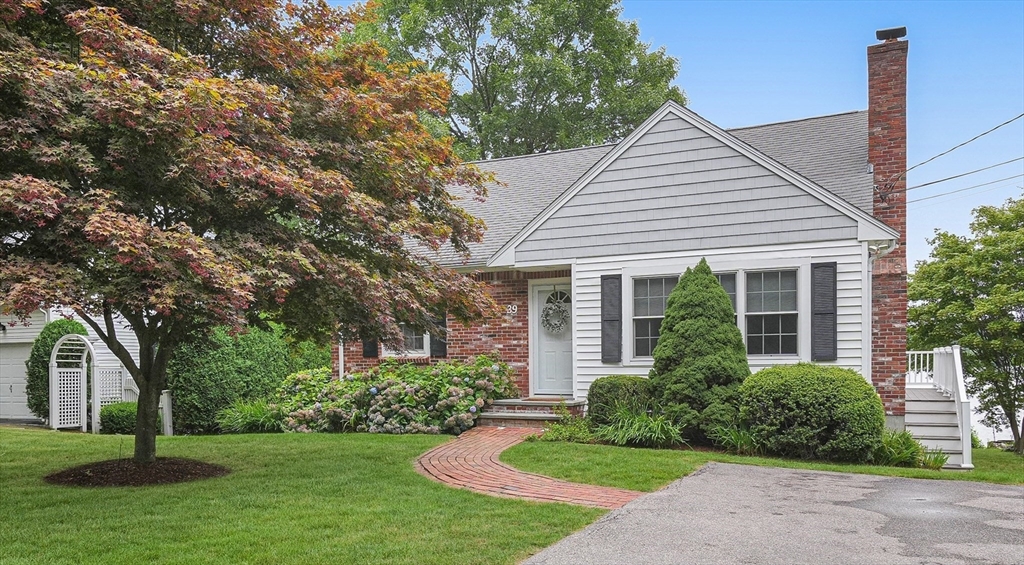 front view of a house and a yard