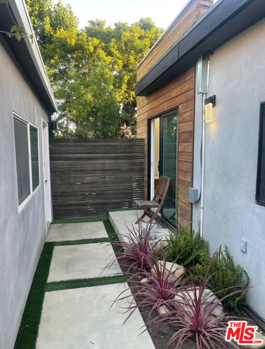 a view of house with backyard