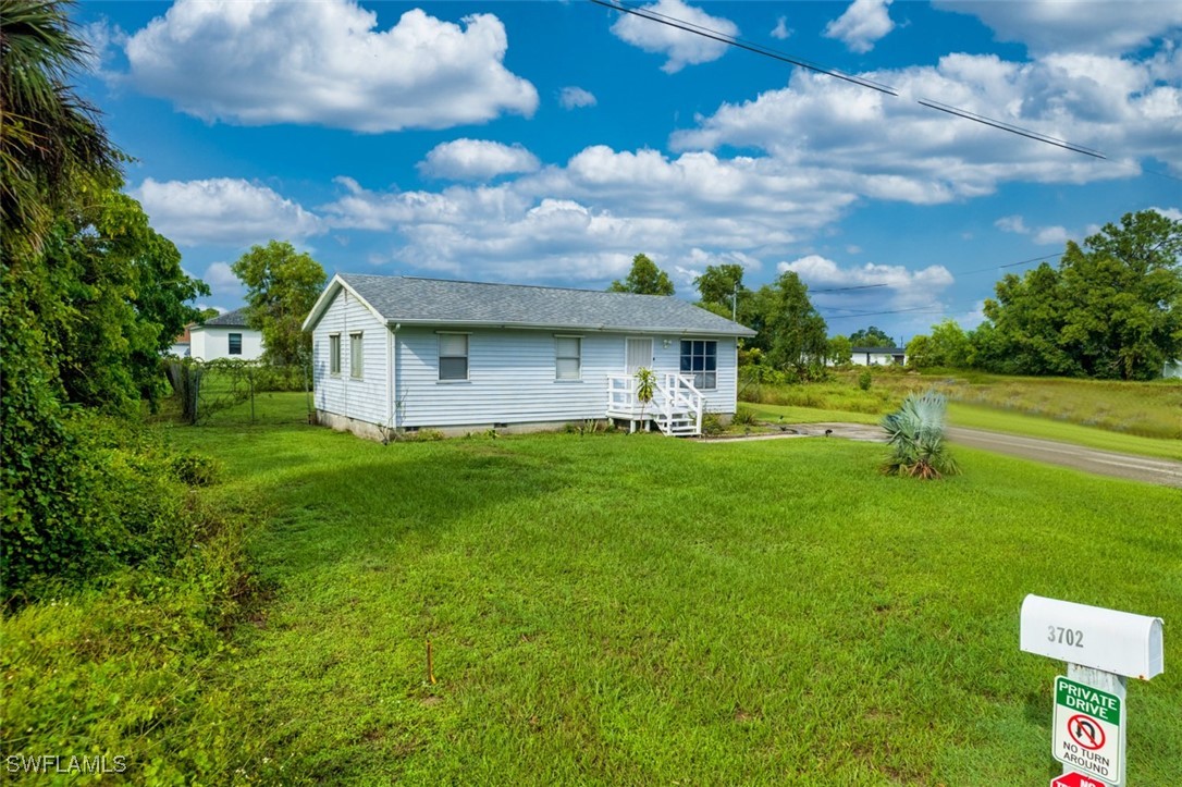 a view of a house with a big yard