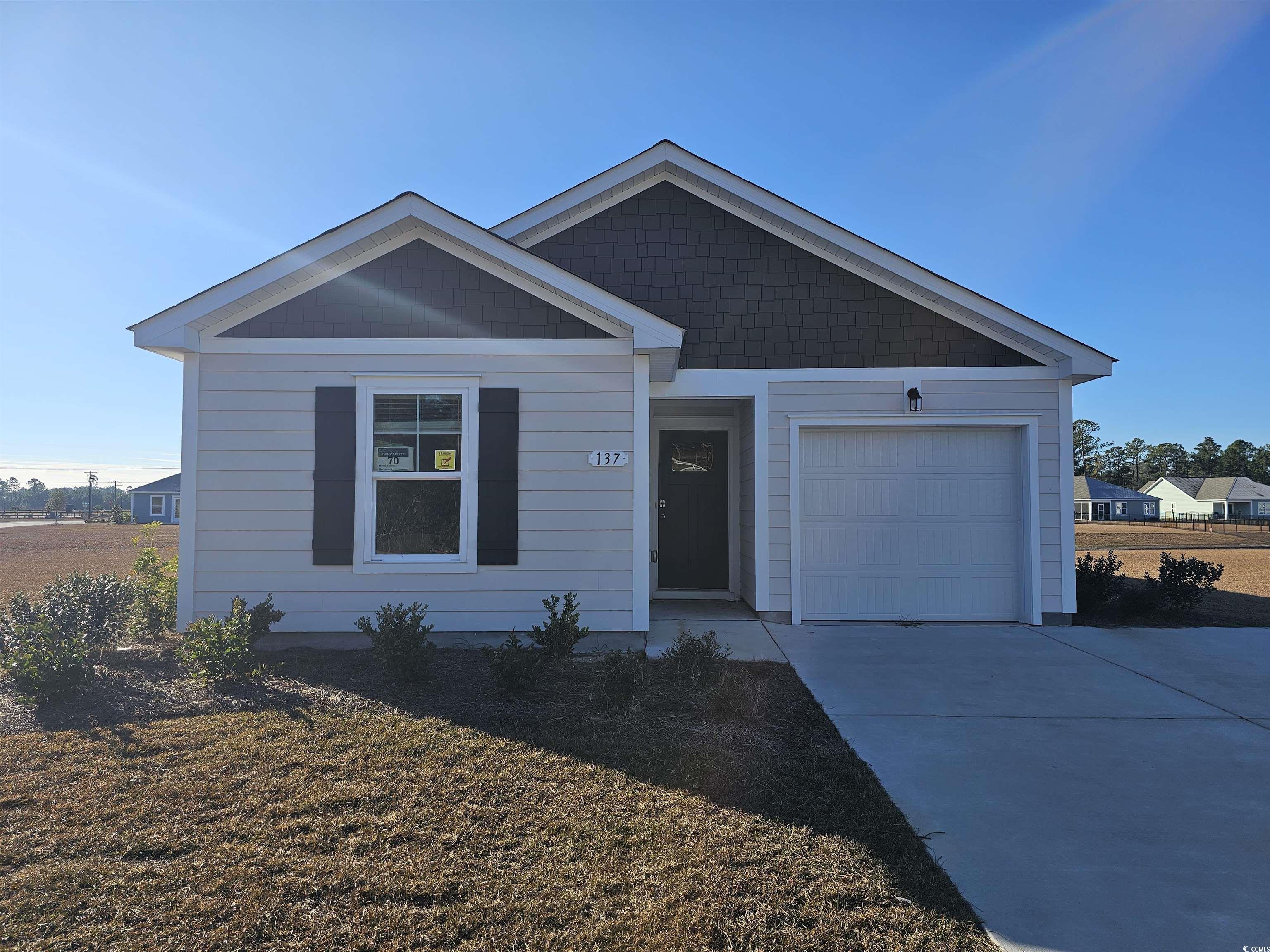 View of front of home with a garage