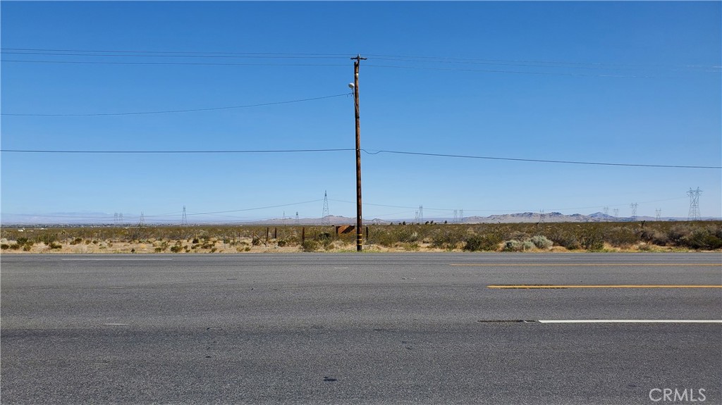 a view of a road with a building in the background