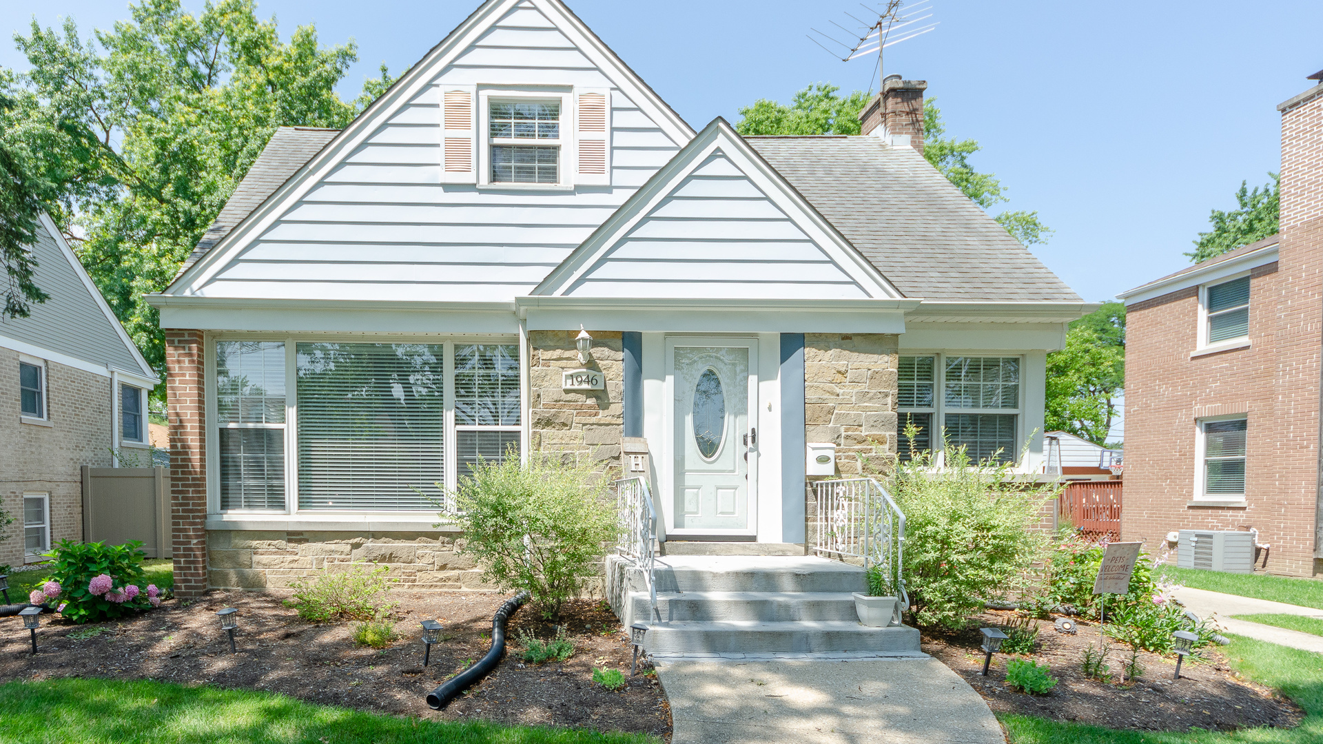 front view of a house with a yard