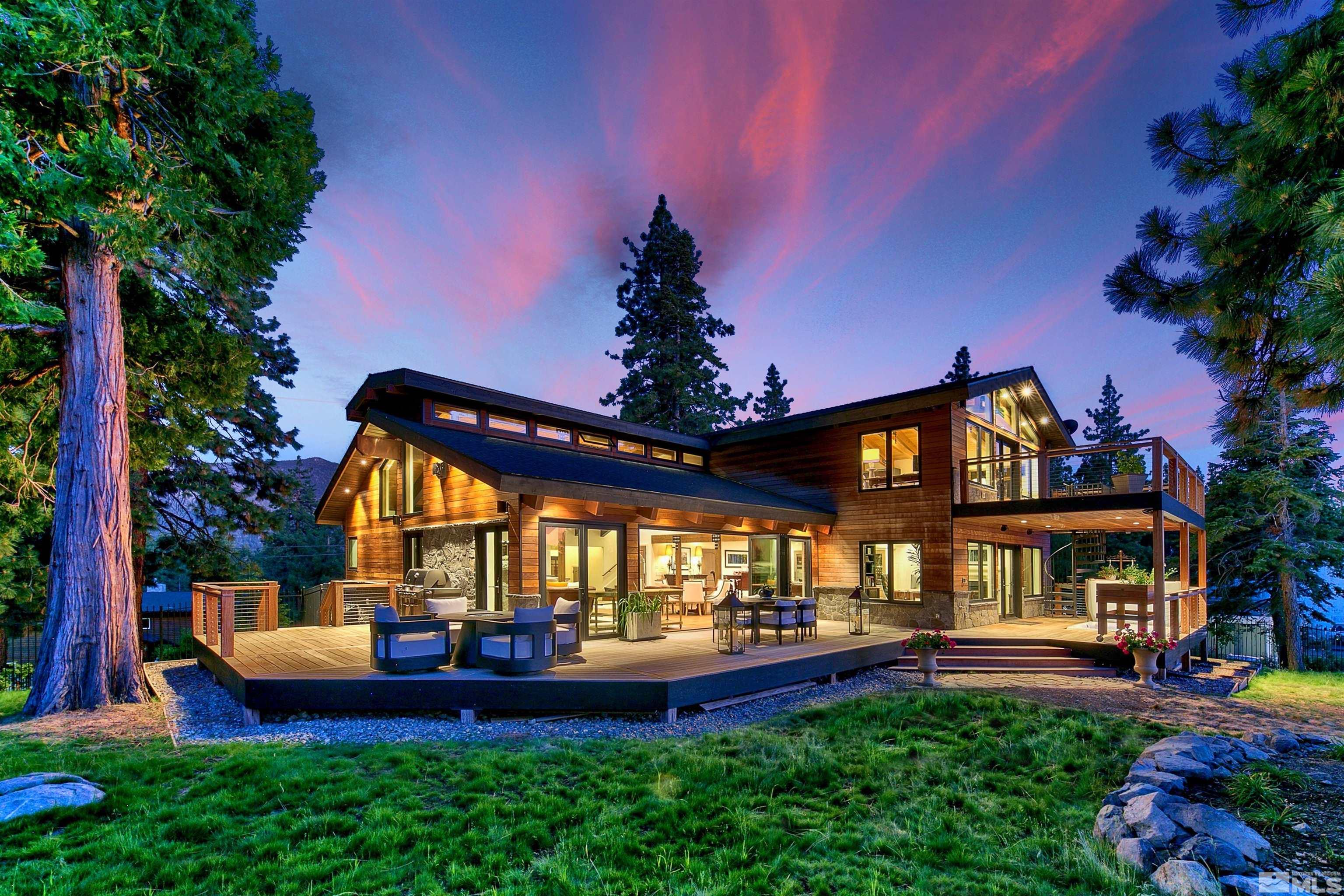 a view of an house with backyard and patio