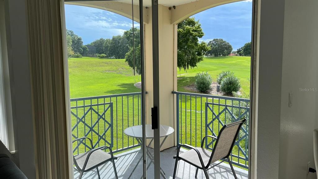 a view of a balcony with garden