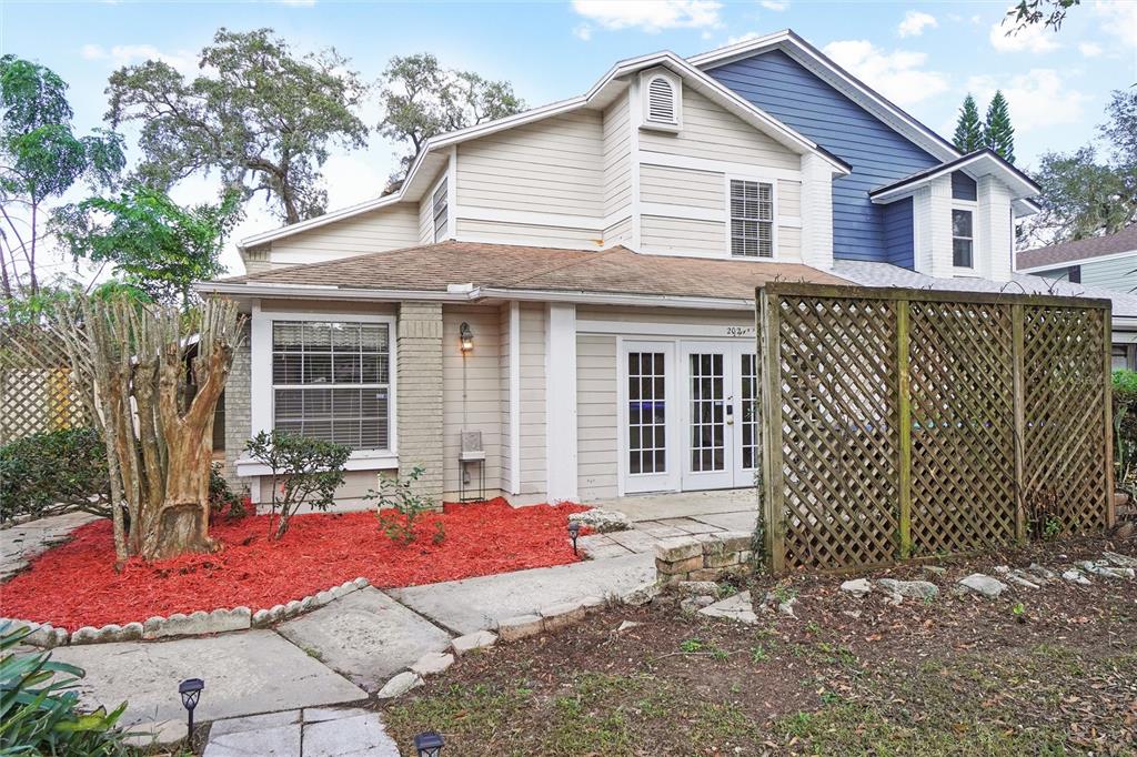 a front view of a house with a garden