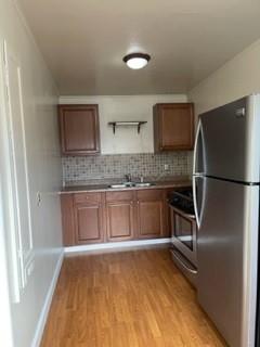 a kitchen with a refrigerator and a sink