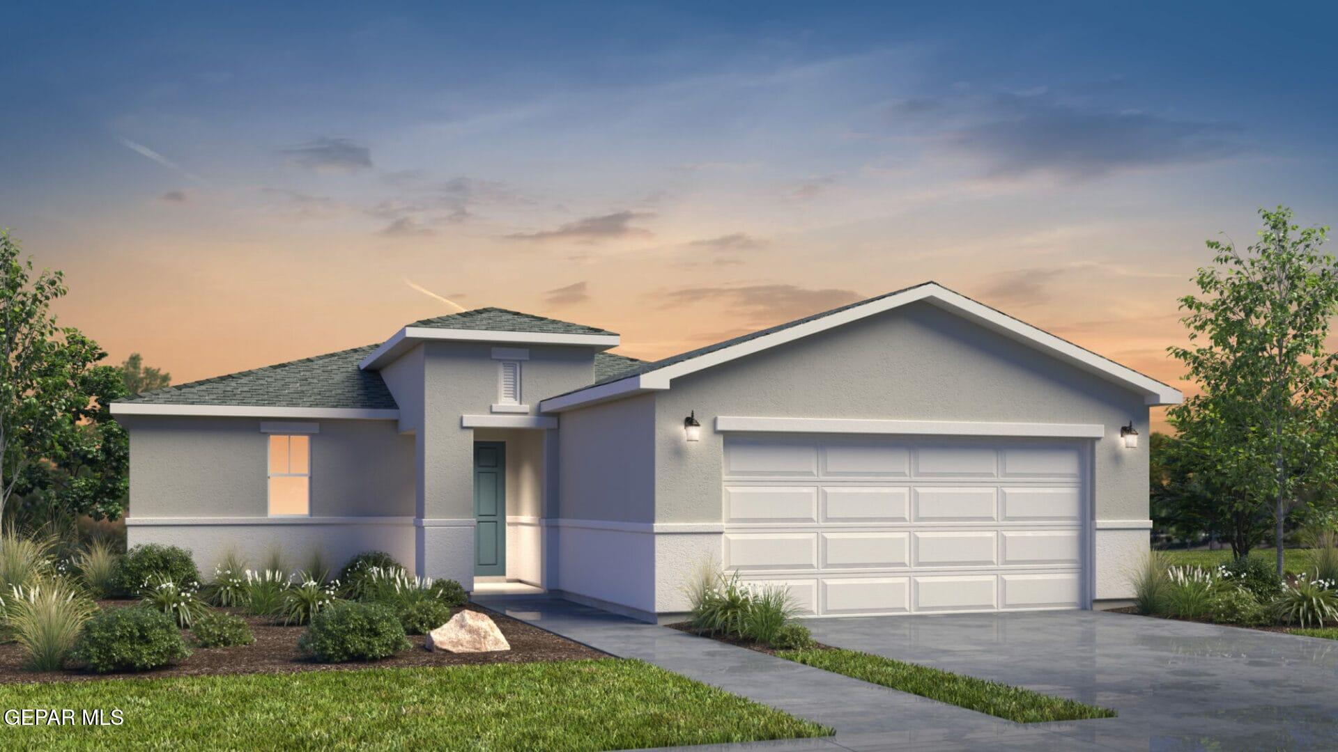 a front view of a house with a yard and garage