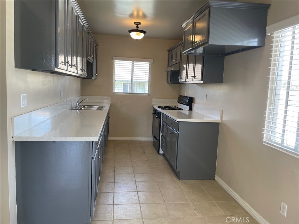 a kitchen with a cabinets and window