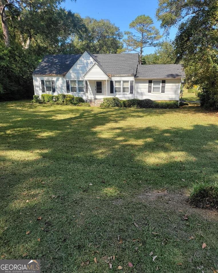 a front view of a house with a yard